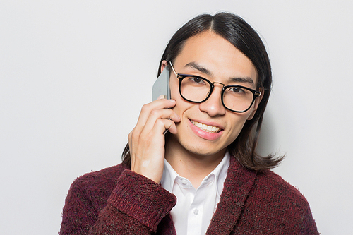 Contemporary young man with smartphone 