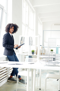 Young banker in formalwear working in modern office