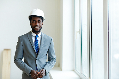 Happy foreman in helmet and suit