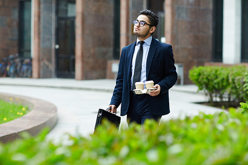 Young ceo enjoying walk in the city