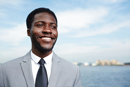 Well-dressed smiling businessman of African-american ethnicity