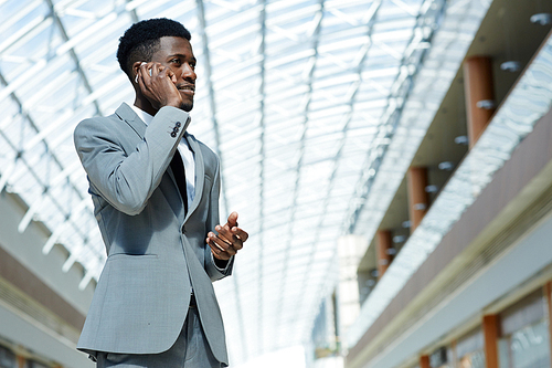 African salesman speaking on cellphone