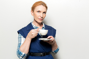 Calm businesswoman with cup of tea 