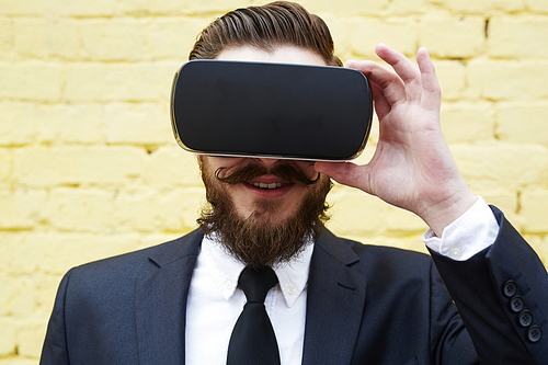 Businessman with augmented reality headset enjoying new experience