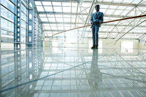 Modern employee in formalwear inside business center