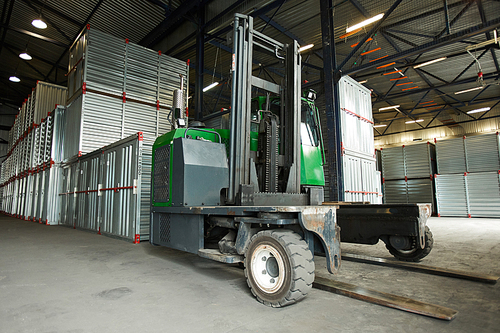 Huge machine for transportation of large storage containers inside hangar