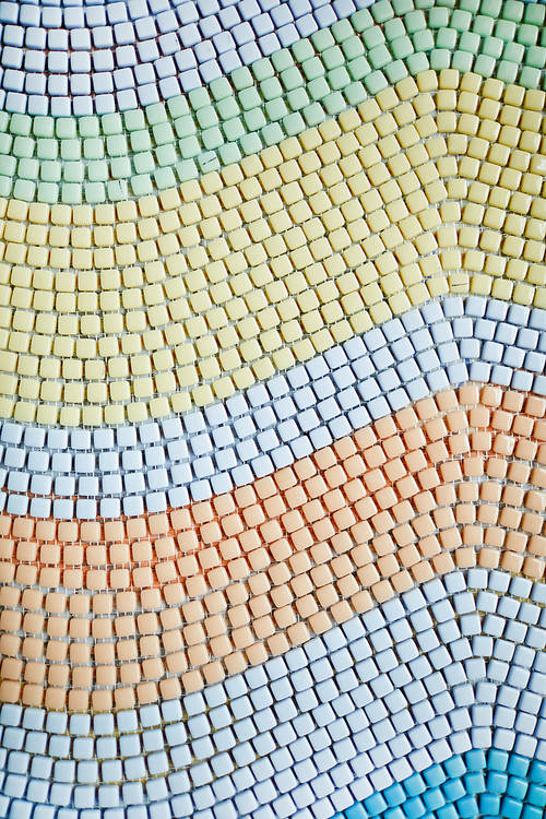 Background of pastel colored square tiles laid out in waves shape, copy space