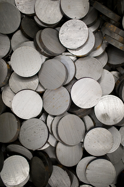 Overview of heap of round details made up of stainless steel that may be used as background