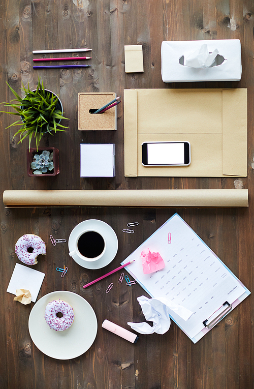 Composition made up of rich variety of business objects on wooden workplace
