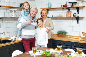 Two adorable grandchildren and their grandparents  with smiles