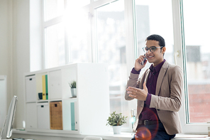 Businessman discussing business plans on the phone at office