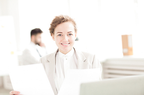 Portrait of smiling businesswoman having a paperwork at office