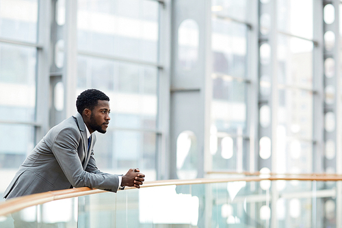 Young employer thinking of forthcoming meeting with business partner