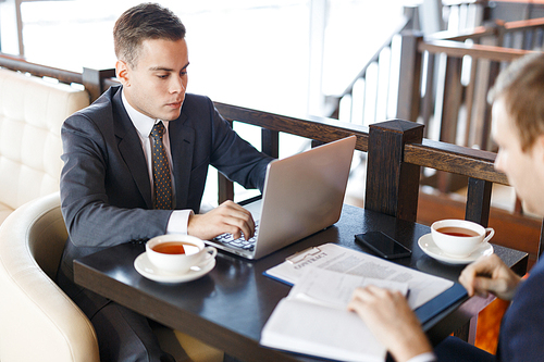 Businessman searching for financial data in the net