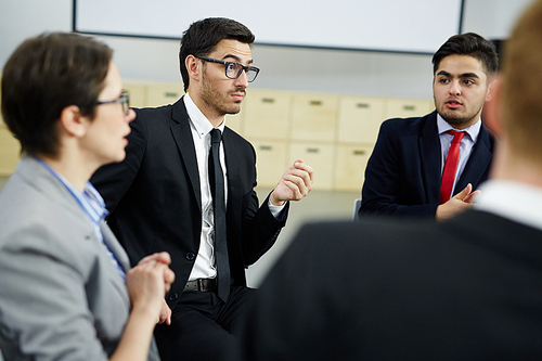 Group of brokers discussing new market trends