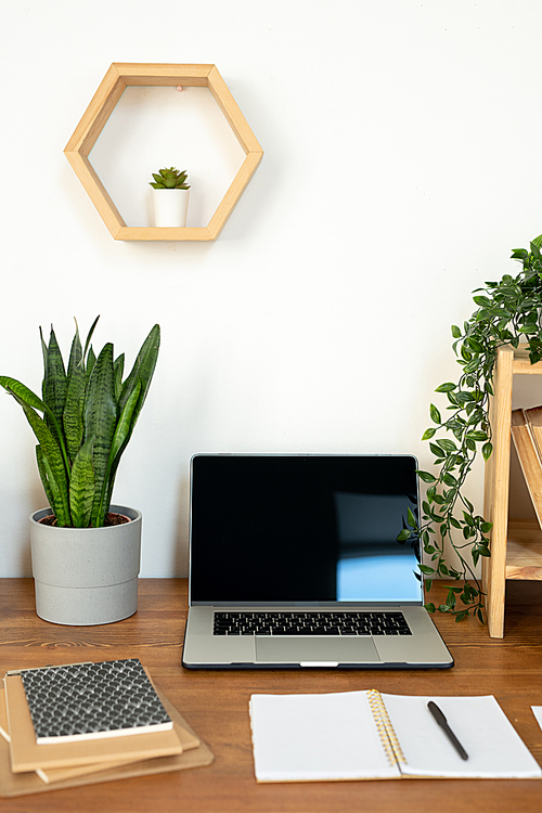 Group of objects for work of office manager, college student or creative designer on desk by wall