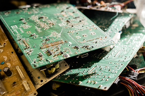 Stack of parts of demounted gadgets ready to be examined and repaired by professional master of technical service