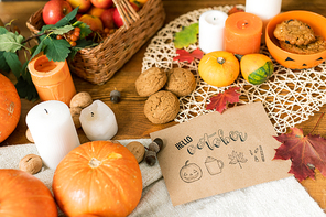 October background with traditional symbols, objects and food on wooden table