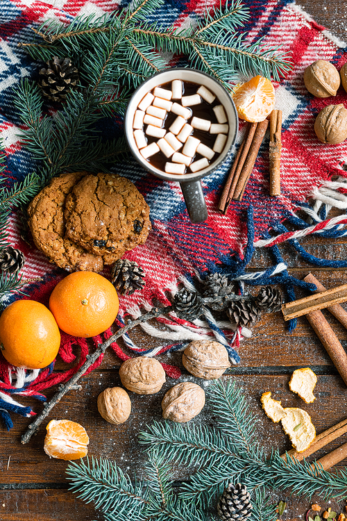 Overview of Christmas symbols, traditional food and spices other objects on wooden table
