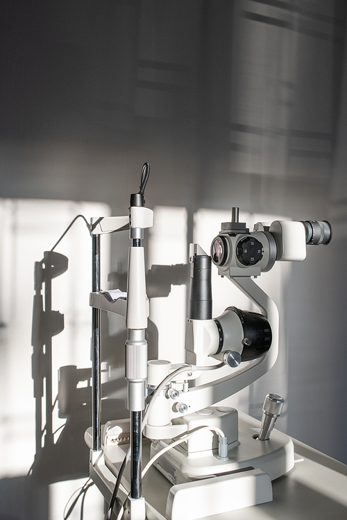 Ophthalmological diagnostic equipment on doctor workplace inside medical office of contemporary ophthalmic clinics or hospital