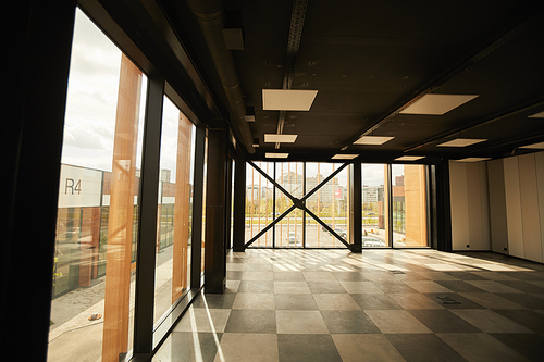 Background image of empty office building interior with contemporary graphic design, copy space