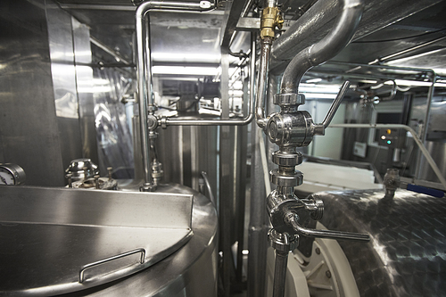 Close up background image of steel machine units at clean food production factory, copy space