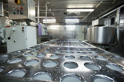 Close up background image of machine units and equipment at clean food production factory, copy space