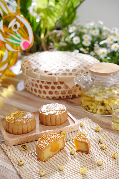 Delicious homemade mooncake with salted egg yolk filling on table prepared for mid autumn festival