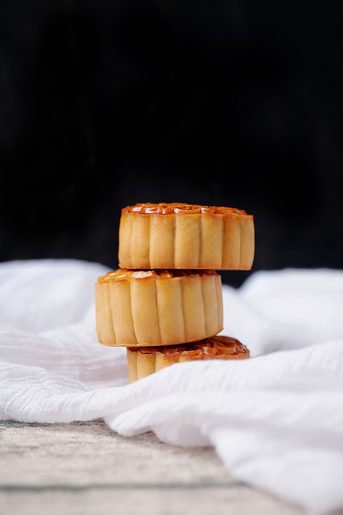 Stack of tasty mooncakes baked for mid autumn celebration, selective focus