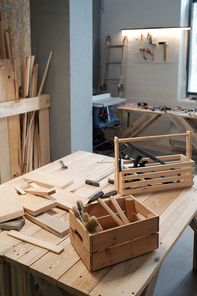 Vertical background image of toolboxes on table in woodworking workshop, copy space