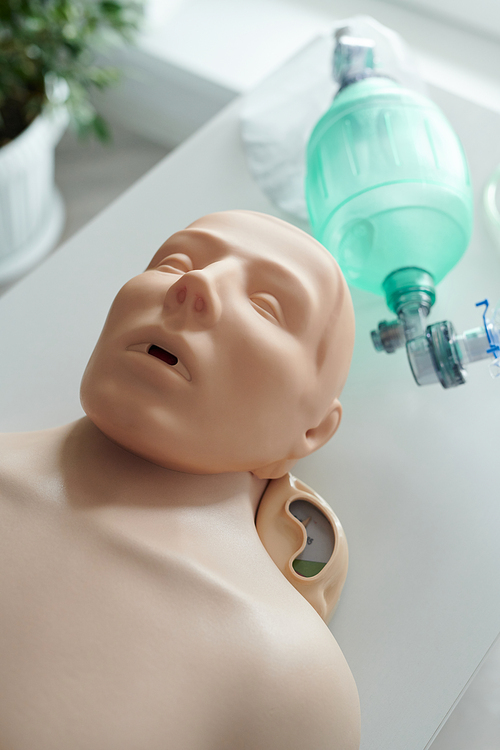 High angle view of training dummy for practicing artificial respiration with oxygen mask