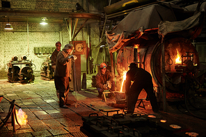 Manual worker melting metal in a furnace for future metal details in the plant