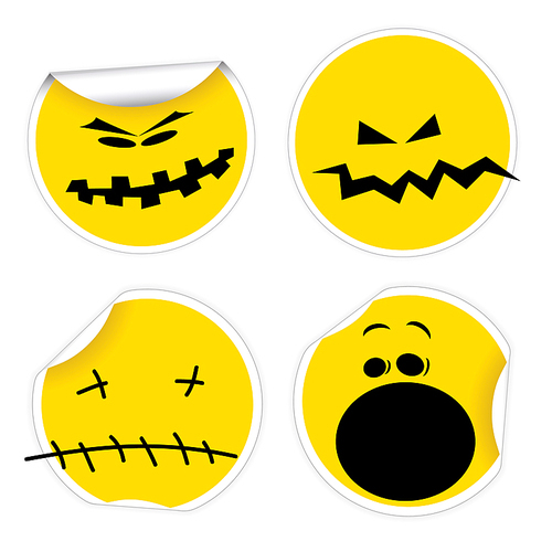 Set of Halloween yellow labels with various smiles