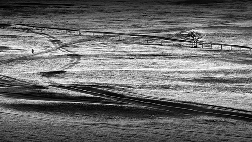 On the morning of the dam, there was a lone photographer in the rugged black and white lines, and I caught it.