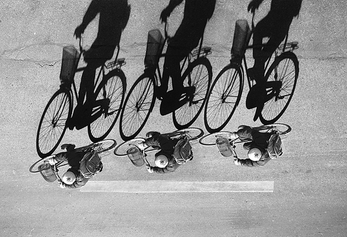 beijing,black and white,the city,bender,pastime,take your seat,bikers,means of transportation,transportation systems,street,adult,team up,.,two,the road,male,a woman,road surface,one,children