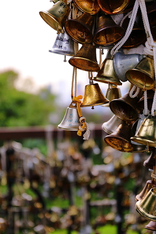 At the cable car park in Huerberg, a guardrail is hung with tiny bells, a token of love for the couple left here.