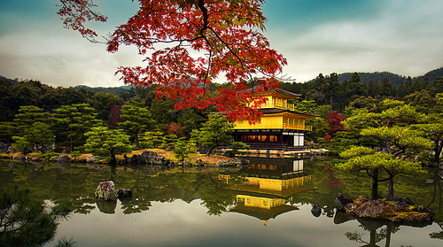 The building outside the deer park temple in Kyoto, Japan, is covered with gold leaf and is also known as the Gold Pavilion. It is a national treasure of Japan and a World Heritage Site.