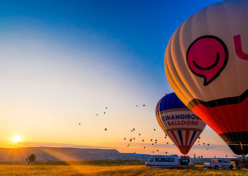 At sunrise, the balloons slowly rise, overlooking the lunar version of the cappadocia.