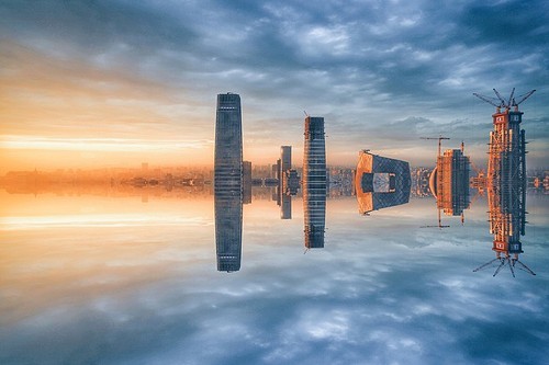 Theme: The Mirror of the Surface,Sunset.,The beach.,No one.,landscape,waters,Travel.,The sea.,The ocean.,dawn,At night.,shoreline,outdoors,light,The city.,The sun.,construction,twilight,Winter.,building