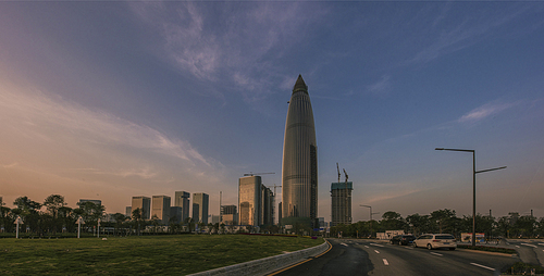 scenery,The city.,color,shenzhen,The sky.,building,skyscraper,The road.,Downtown.,skyline,street,traffic,outdoors,Transportation Systems,cityscape,Sunset.,Daylight.,twilight,Business.