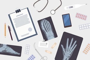 Doctor's or surgeon's table. Paper document, x-rays or radiographs of various body parts, smartphone, medications and medical tools lying on desk. Colorful vector illustration in flat cartoon style.