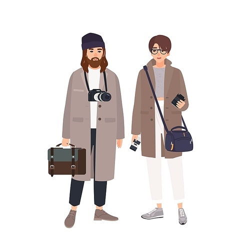 Portrait of male photographer and his female assistant in coats isolated on white . Pair of professional photo journalists with cameras standing together. Flat cartoon vector illustration