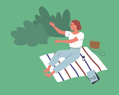 Happy young woman sitting on blanket in park and enjoying music in earphones. Scene of recreation outdoors and summer leisure. Flat vector cartoon illustration of relaxing female character.