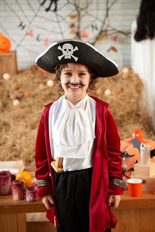 Portrait of smiling kid in pirate costume