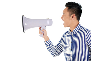 Asian young entrepreneur shouting into loudspeaker to make announcement