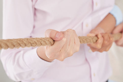 Close-up image of rope in hands of man, selective focus