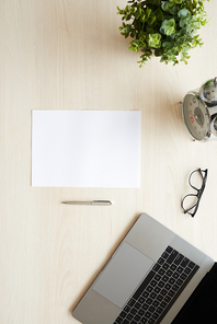 Blank white sheet on table: creativity concept