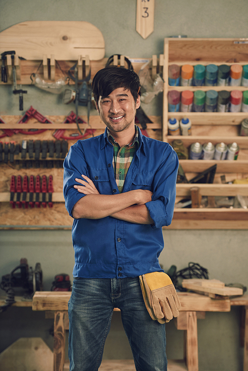 Portrait of Asian carpenter smiling and 