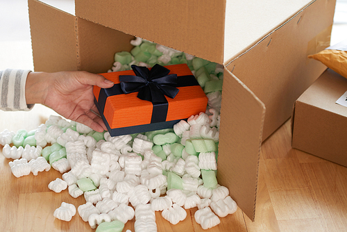 Close-up image of person taking gift box she received