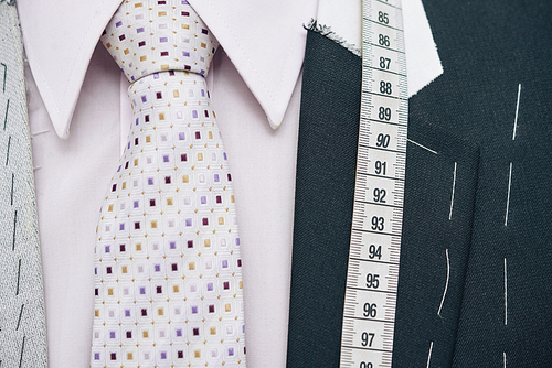 Bespoke jacket with necktie and measuring tape
